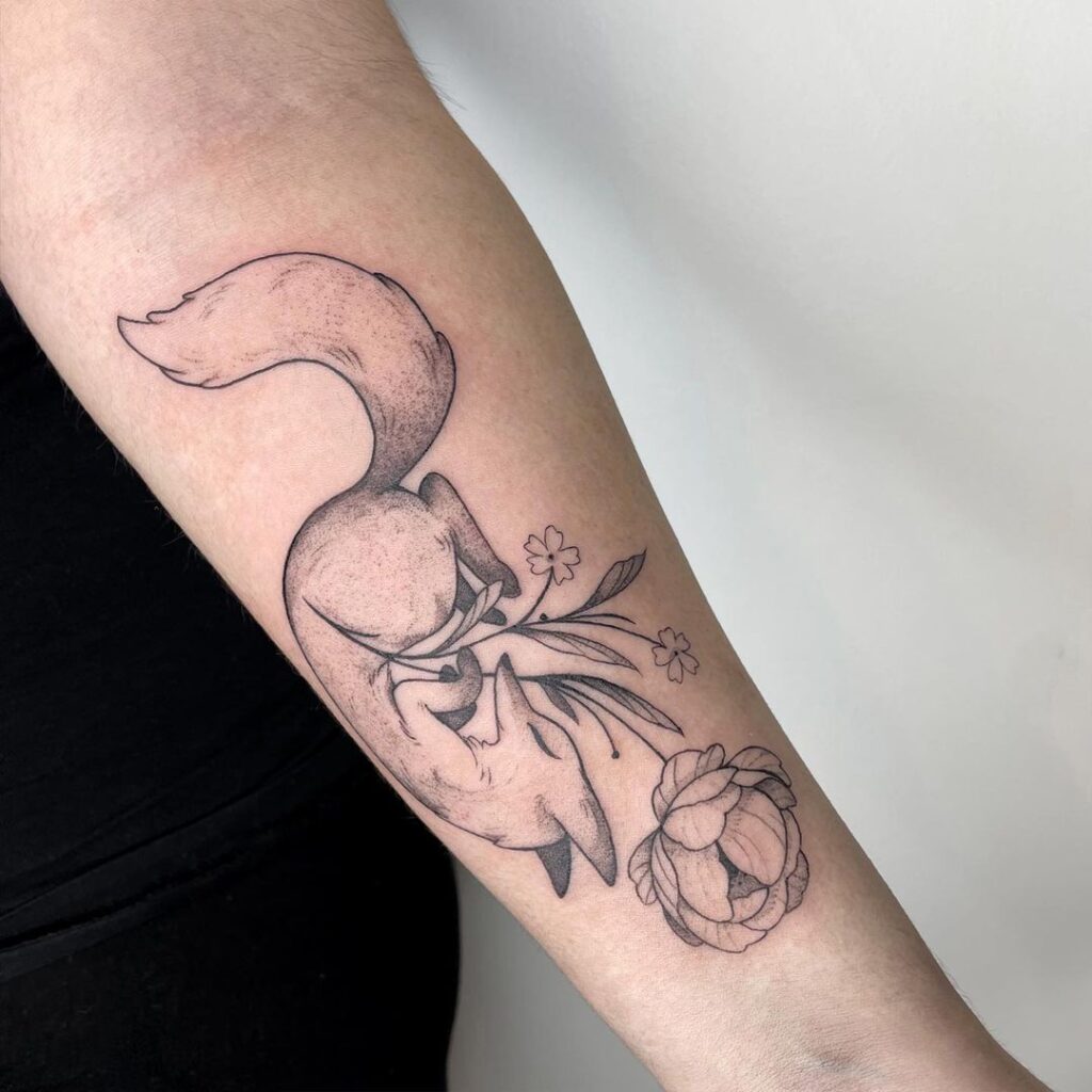 Calm fox with a floral touch on the forearm serene elegance