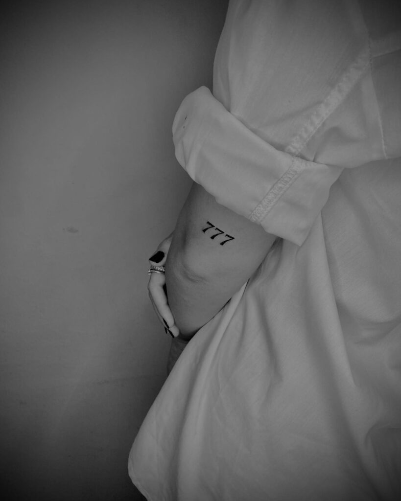 777 Angel Number Tattoo on the Back of the Elbow: Celestial Bend 
