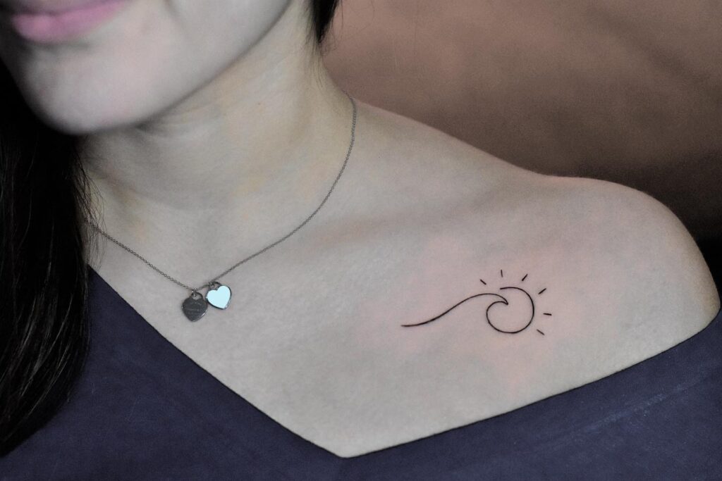 Charming Side Chest Tattoos: Cute Sun and Wave Designs for Females