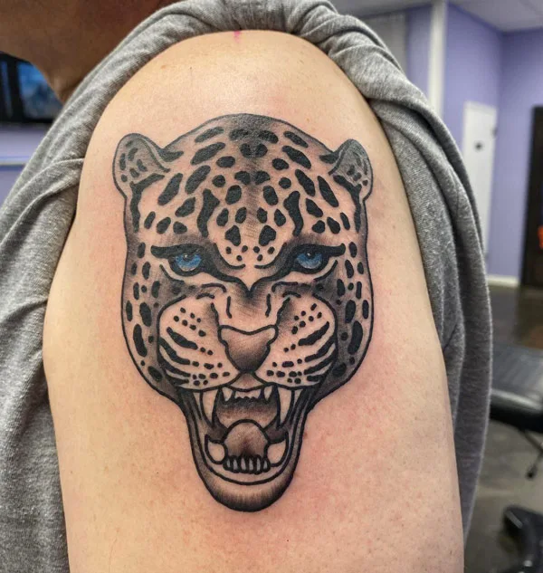 Cheetah face tattoo
