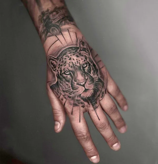 Cheetah hand tattoo