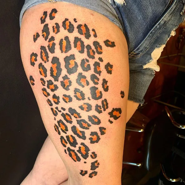 Cheetah print tattoo