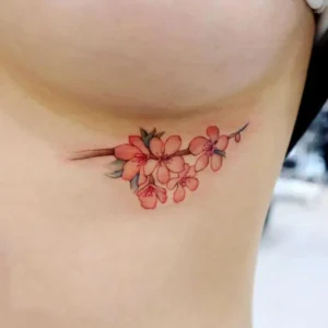 Cherry blossom under breast tattoo 1