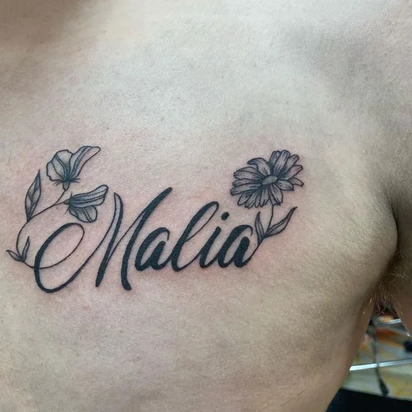 Chest name tattoo