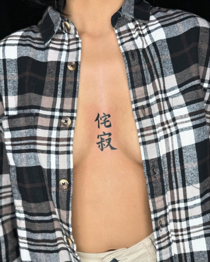 Chinese character sternum tattoo with poetic and reflective symbolism