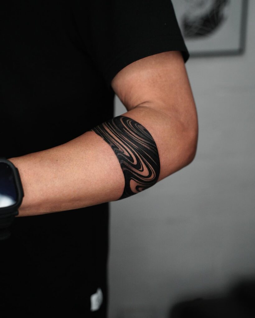 Classic Black Work Band Tattoo, Wrapped Stylishly Around the Forearm: Ink Ensemble