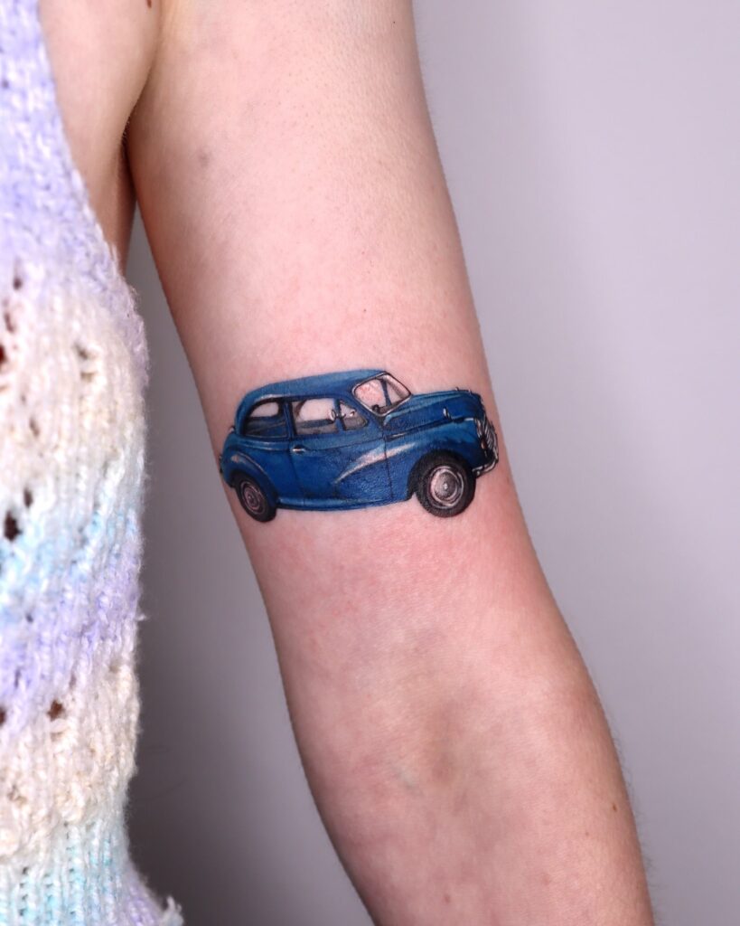 Classic Blue Morris Minor Tattoo with Realistic Shading on Arm – Car Tattoo Ideas