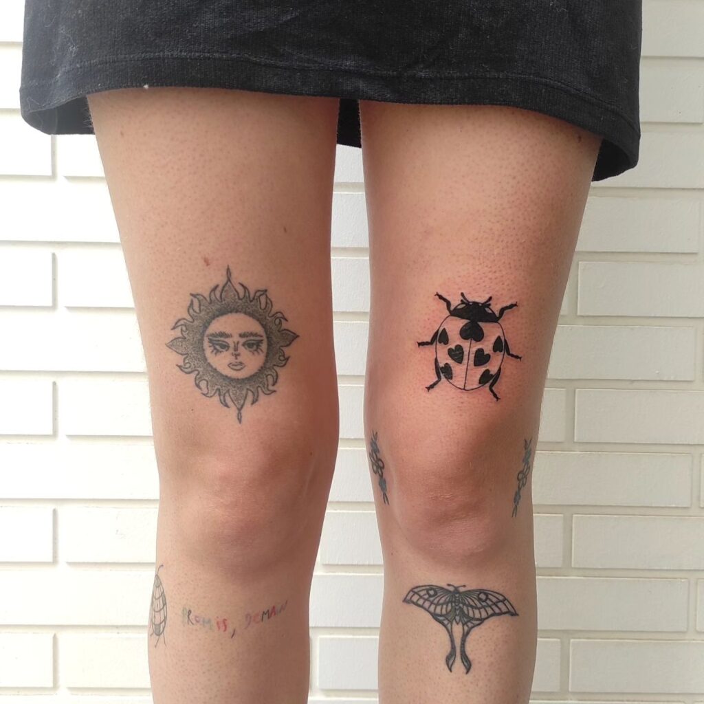 Classic elegance black and white ladybug tattoo above the knee for girls