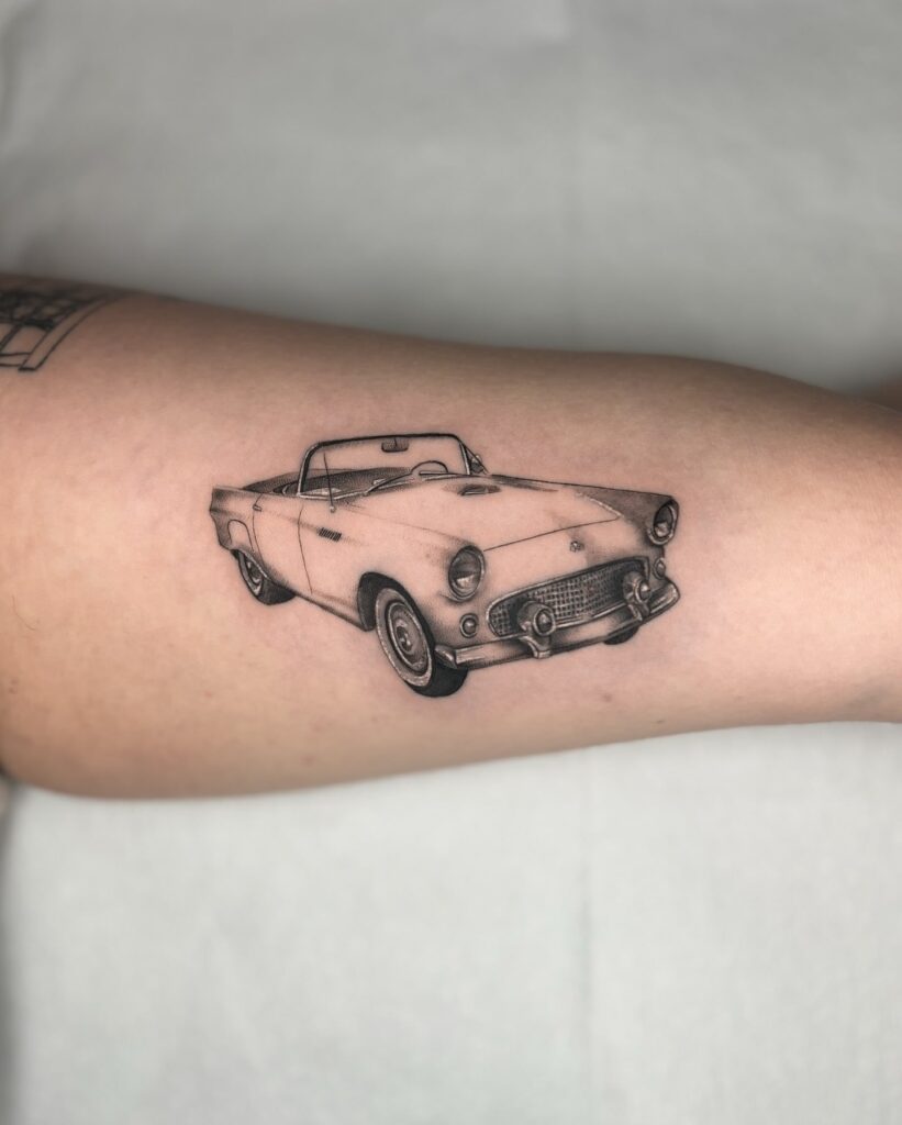 Classic Ford Thunderbird Tattoo in Realistic Black and Gray Style on Inner Arm – Car Tattoo Ideas