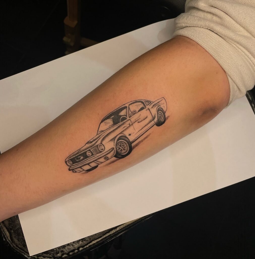 Classic Muscle Car Tattoo (Vintage Mustang) with Black-and-Grey Detailing – Car Tattoo Ideas