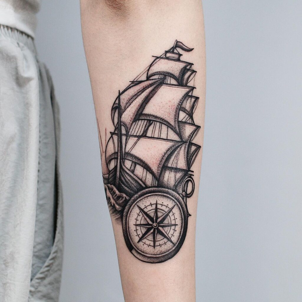 Classic Ship Design with Compass Tattoo on the Outer Forearm: Nautical Elegance
