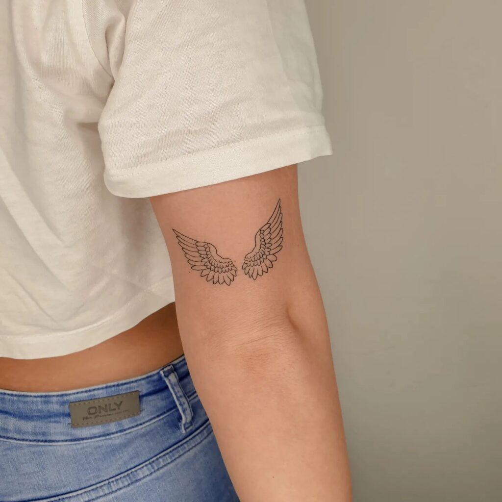 Classy Fineline Wing Tattoo Back of the Above the Elbow for Girls: Elegance Elevated