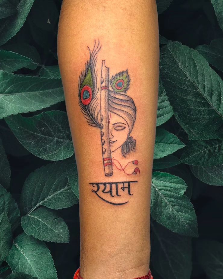 Classy Flute and Peacock Feather Tattoo with Text "Shyam" on Hand : Artistic and Meaningful