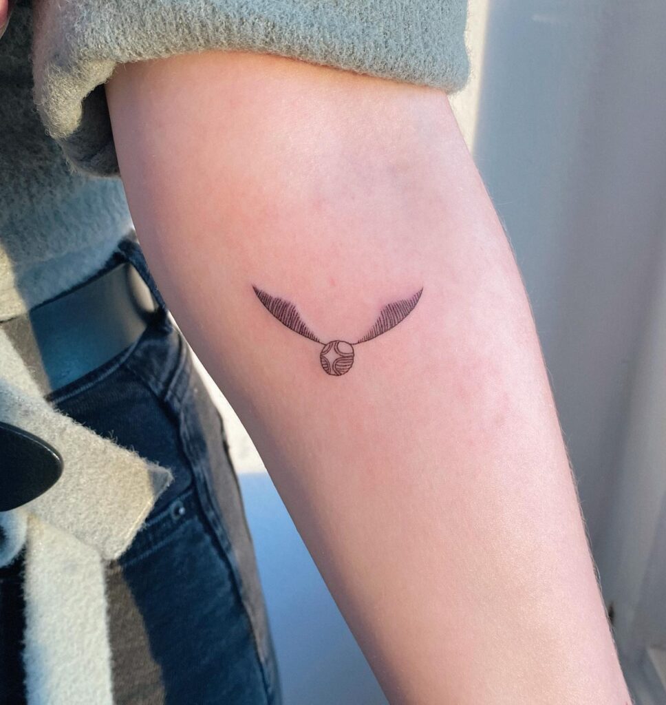 Classy inner forearm golden snitch tattoo timeless charm for girls