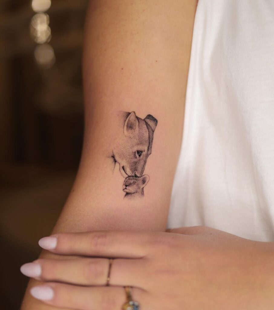 Classy mother and daughter lion tattoo, lioness mother kissing her cub: maternal love