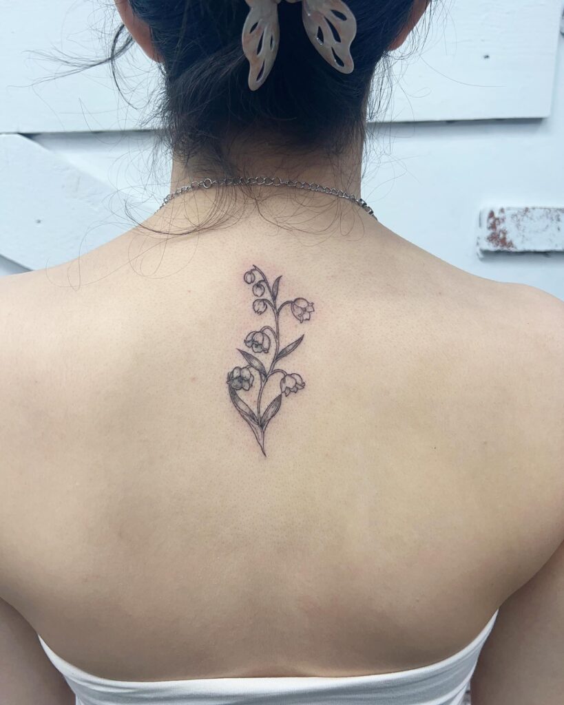 Clean Bluebell Tattoo on the Back of the Neck for Females