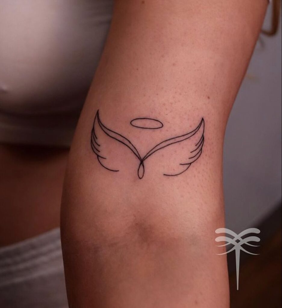 Clean and Crisp Outline of Wing Tattoo Above the Inner Elbow: Crisp Contours