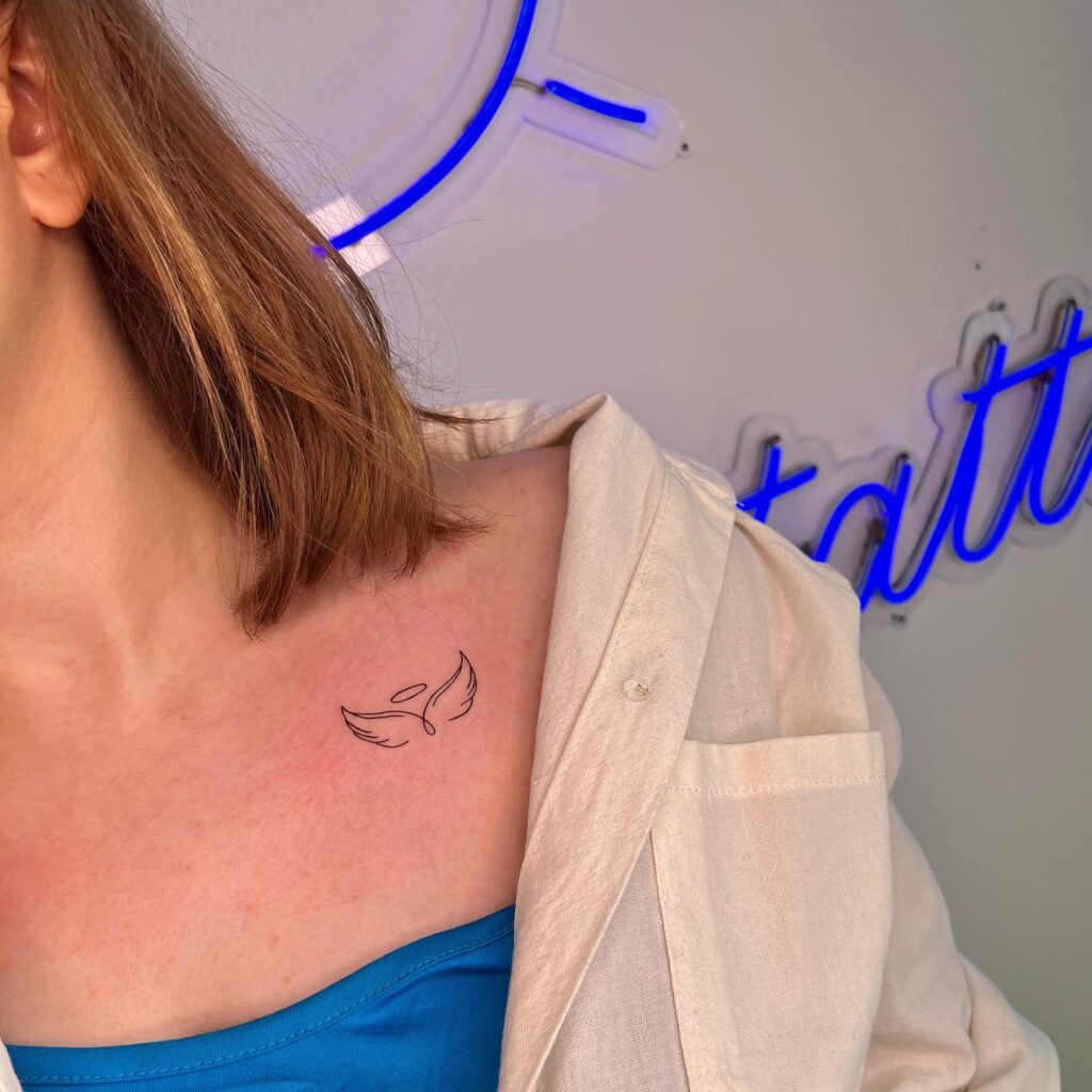 Clean and Simple Tiny Wings Tattoo on the Collarbone, Fineline Finesse: Airy Elegance
