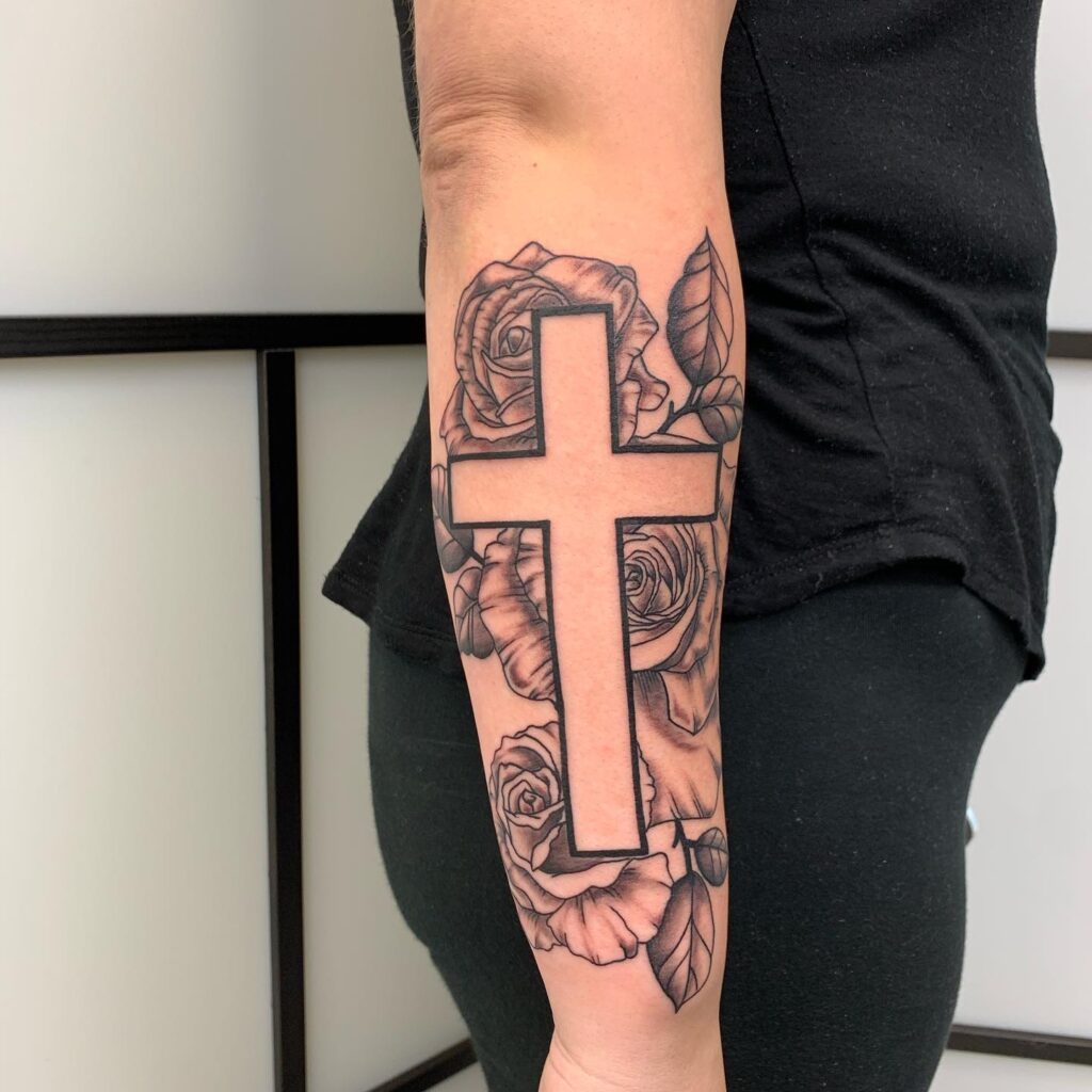 Clean Line Work Roses with Negative Space Cross Tattoo on Outer Forearm: Linear Elegance