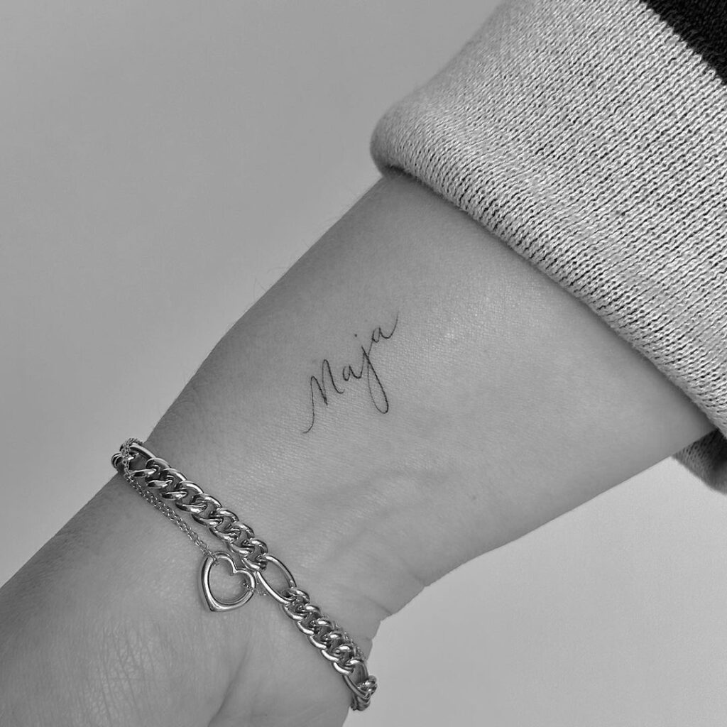 Clean maja letter script tattoo on the wrist personalized ink