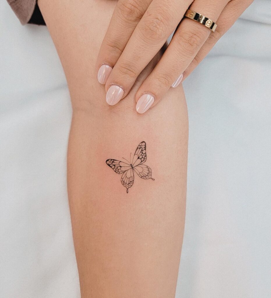 Clean Small Butterfly on the Forearm Tattoo for Girls: Delicate Flutter