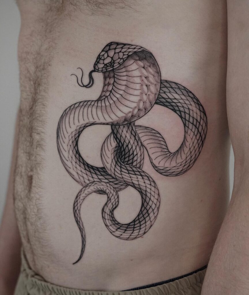 Cobra tattoo for men on the side stomach with striking pattern and aggressive tongue out: stomach sentinel