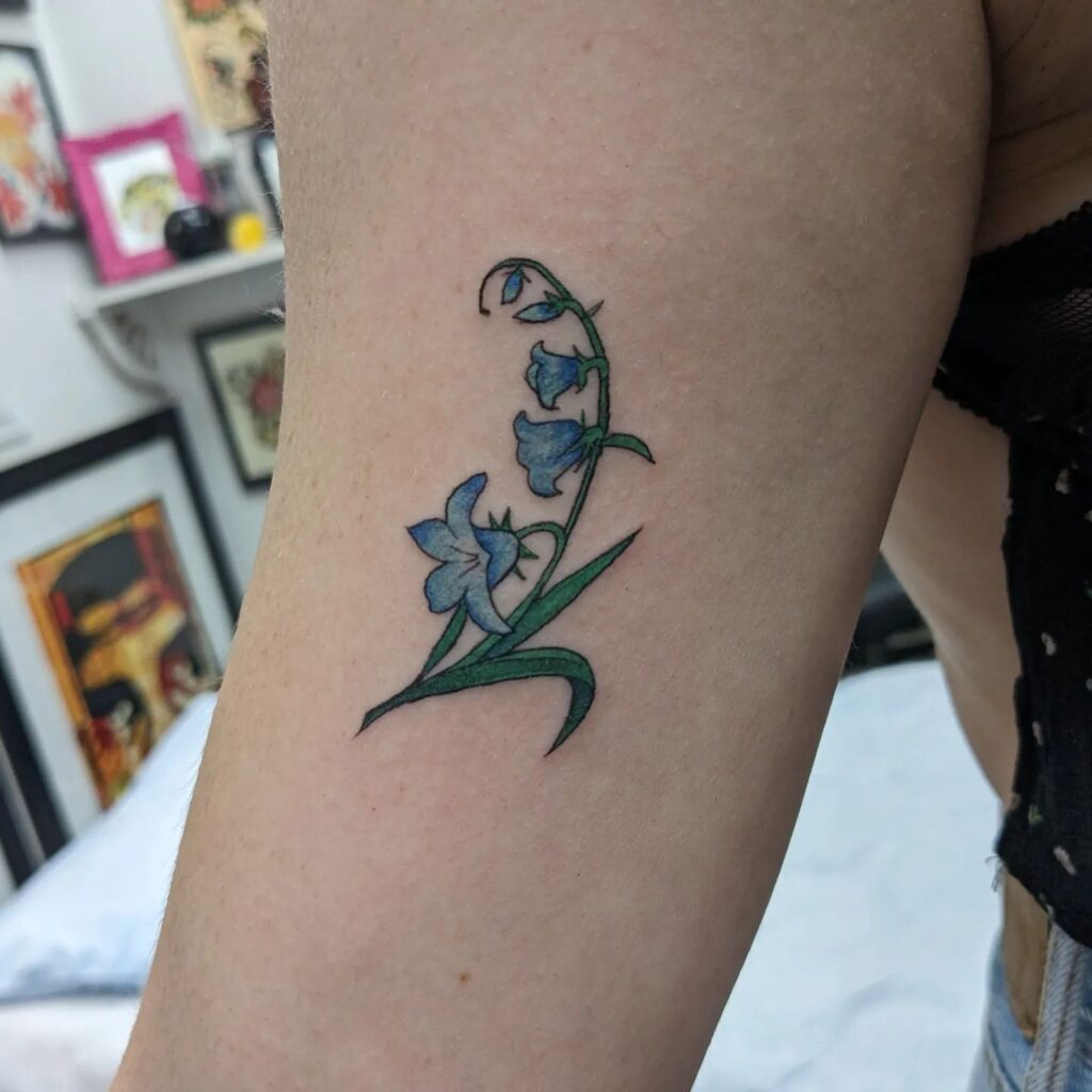 Colorful Little Bluebell Flower Tattoo for a Vibrant Touch: Bicep Bloom
