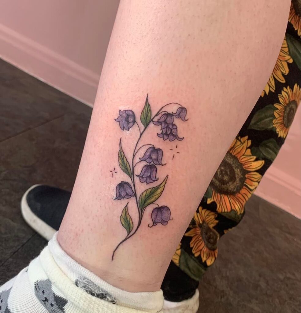 Colorful mini bluebell tattoo above the ankle tiny beauty