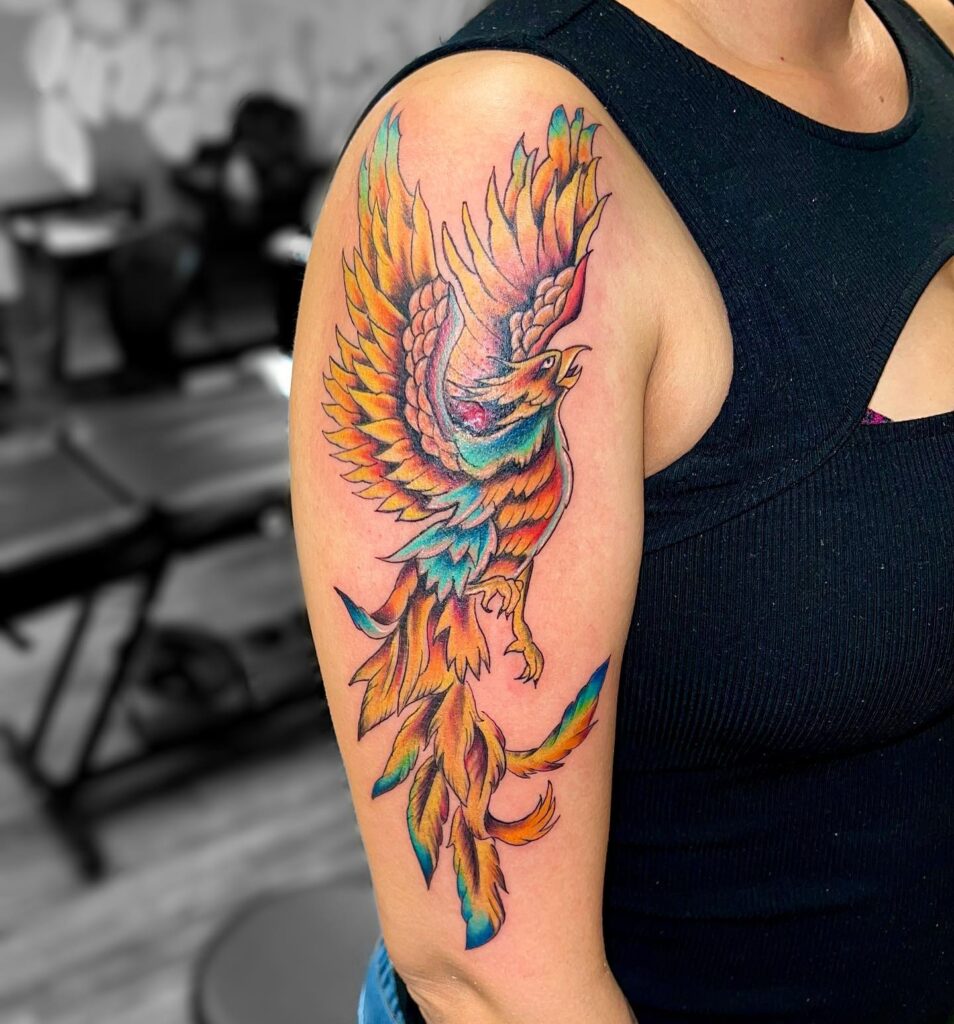 Colorful phoenix half sleeve tattoo: resplendent mythical rebirth and vibrant beauty