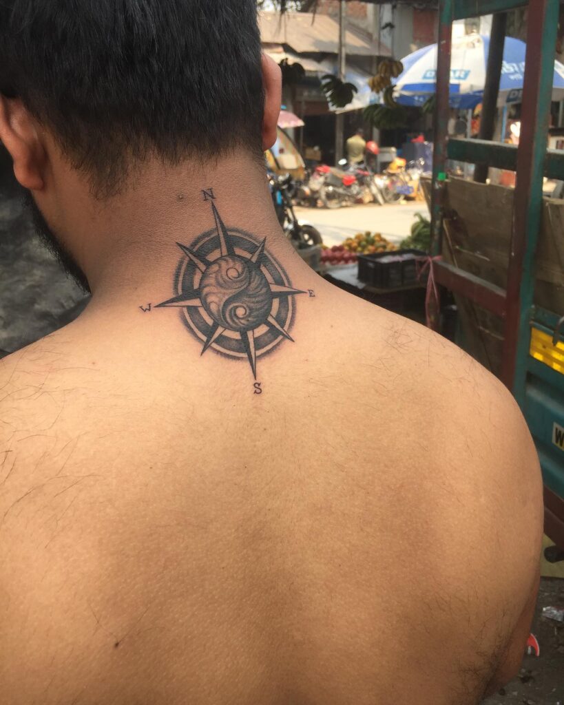 Compass and yin yang fusion on the back of the neck for men: yin yang north star
