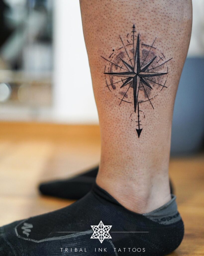 Compass tattoo above the ankle for a grounded journey: ankle navigator