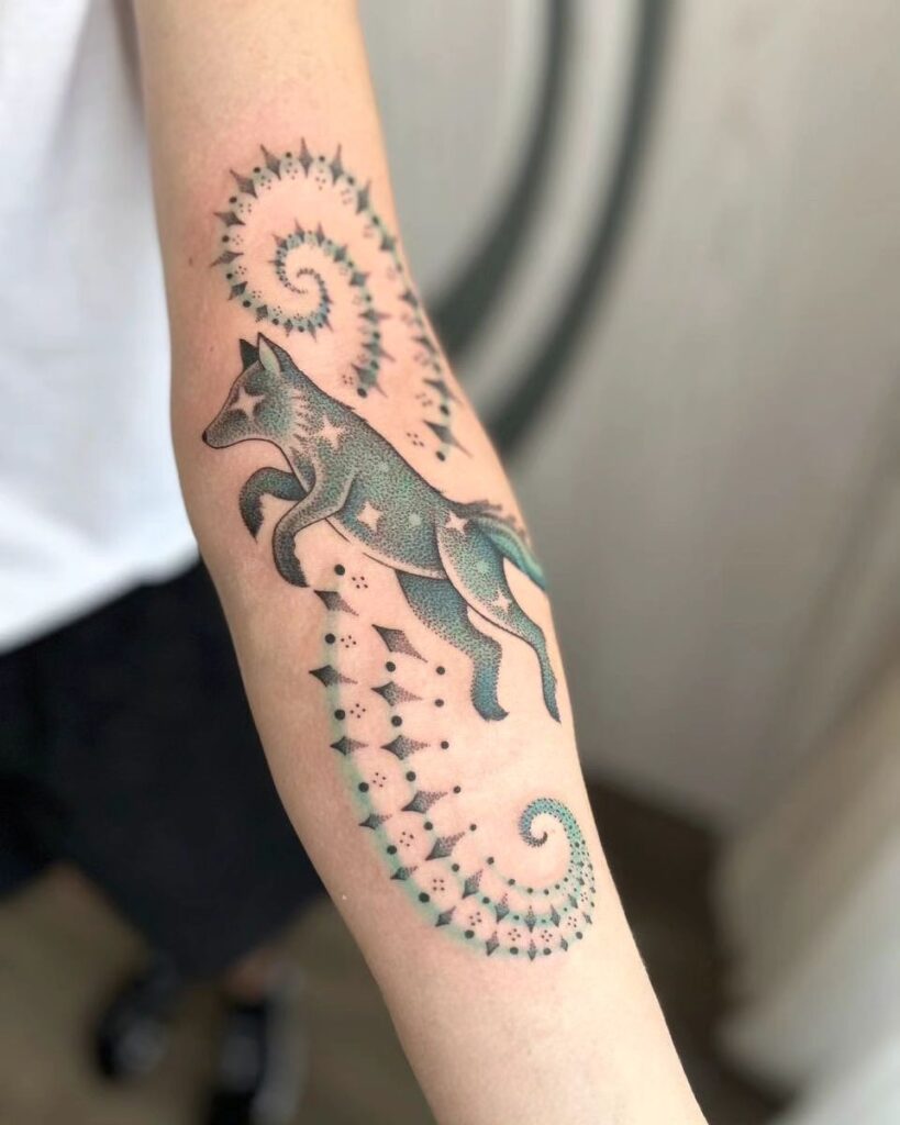 Cosmic fox with astral stars a celestial journey on the forearm