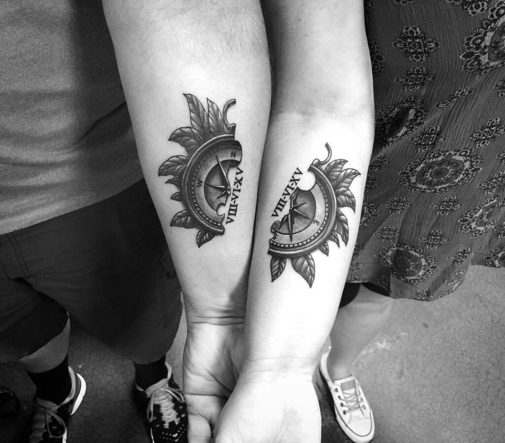 Couple's matching forearm tattoos with compass and anniversary date in roman numerals: marital navigation