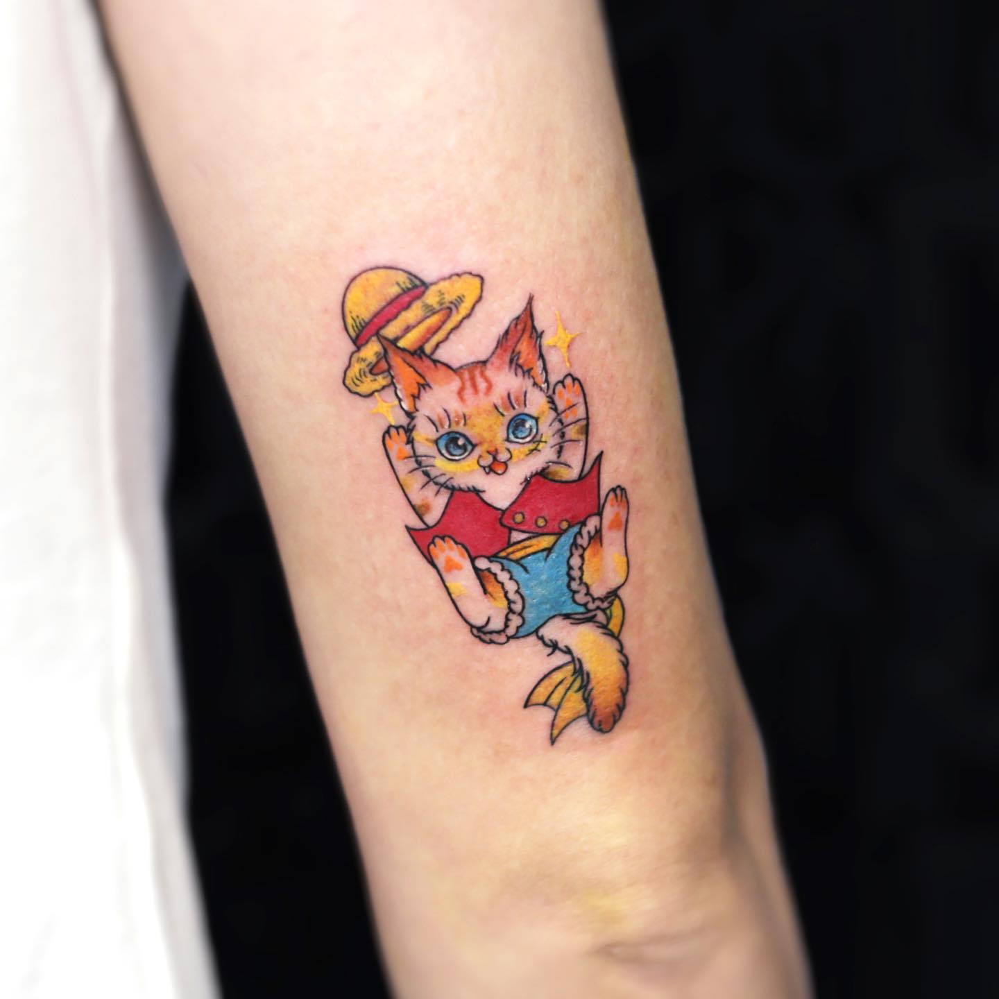 Creative anime-inspired One Piece Luffy cat tattoo with watercolor shading, perfect for fans of both feline art and adventurous anime themes