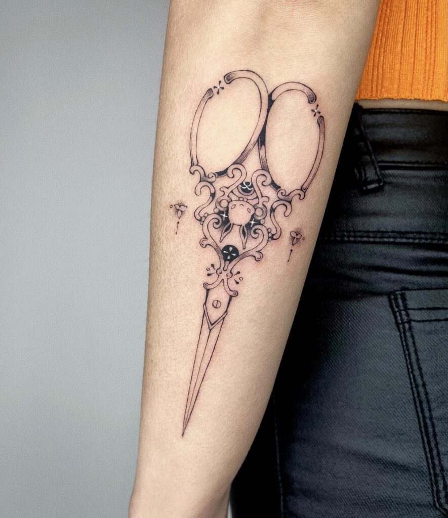 Creative cut outer forearm scissors tattoo