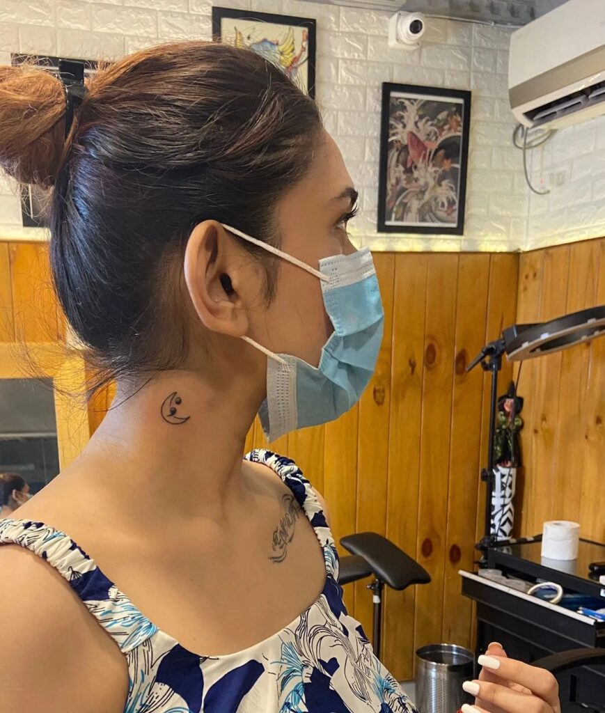 Crescent Moon and Semicolon Tattoo on the Side of the Neck: Celestial Connection