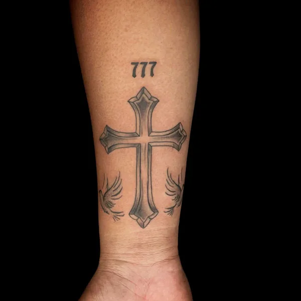 Cross 777 tattoo