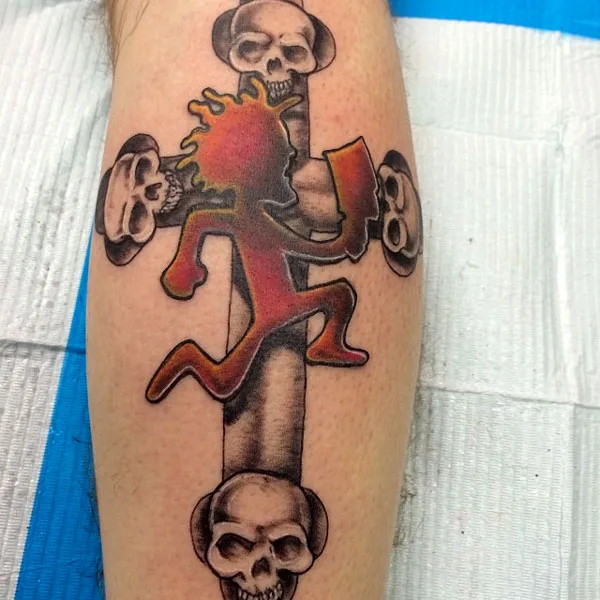 Cross hatchet man tattoo