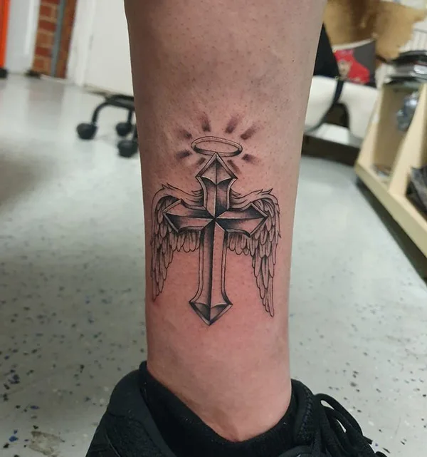 Cross with angel wings tattoo
