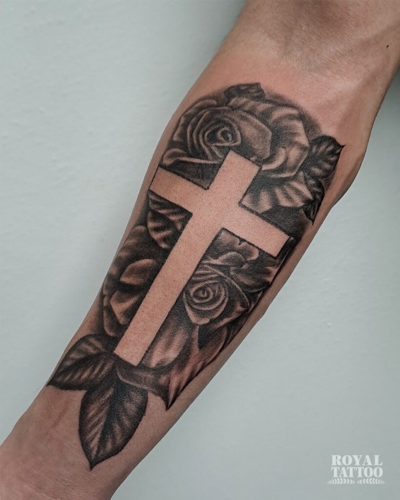 Cross with Roses Tattoo, Blackwork Ink for a Striking Effect: Forearm Elegance