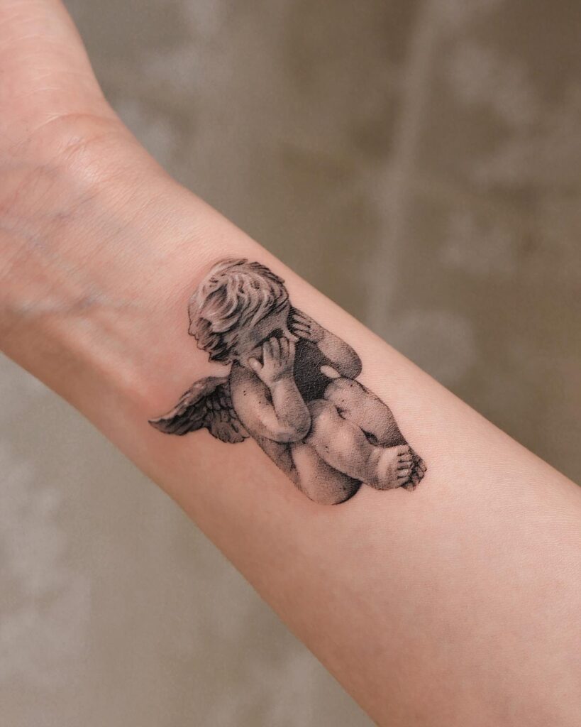 Cry Baby Angel Tattoo on the Inner Wrist: Teardrop Lullaby