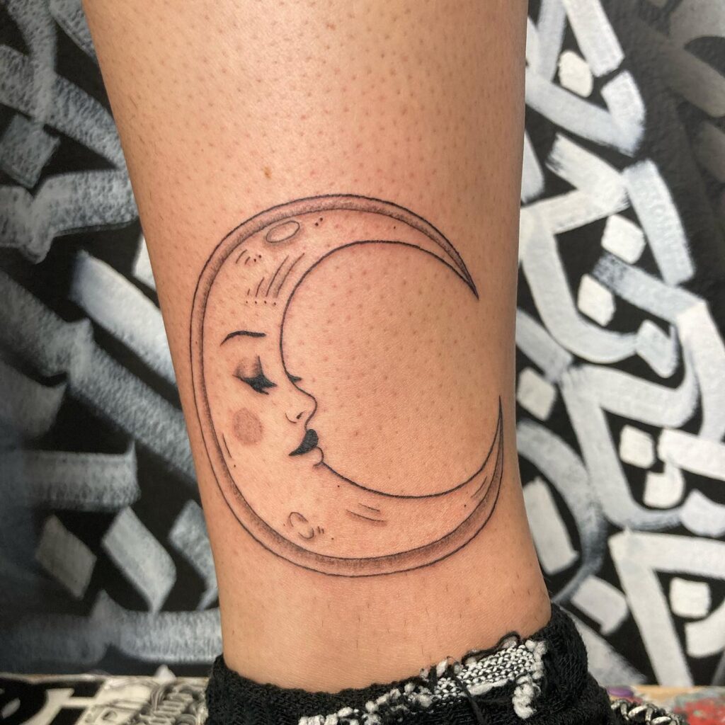 Custom Crescent Moon with Riverside Scene, a Unique Female Leg Tattoo: Celestial Waters