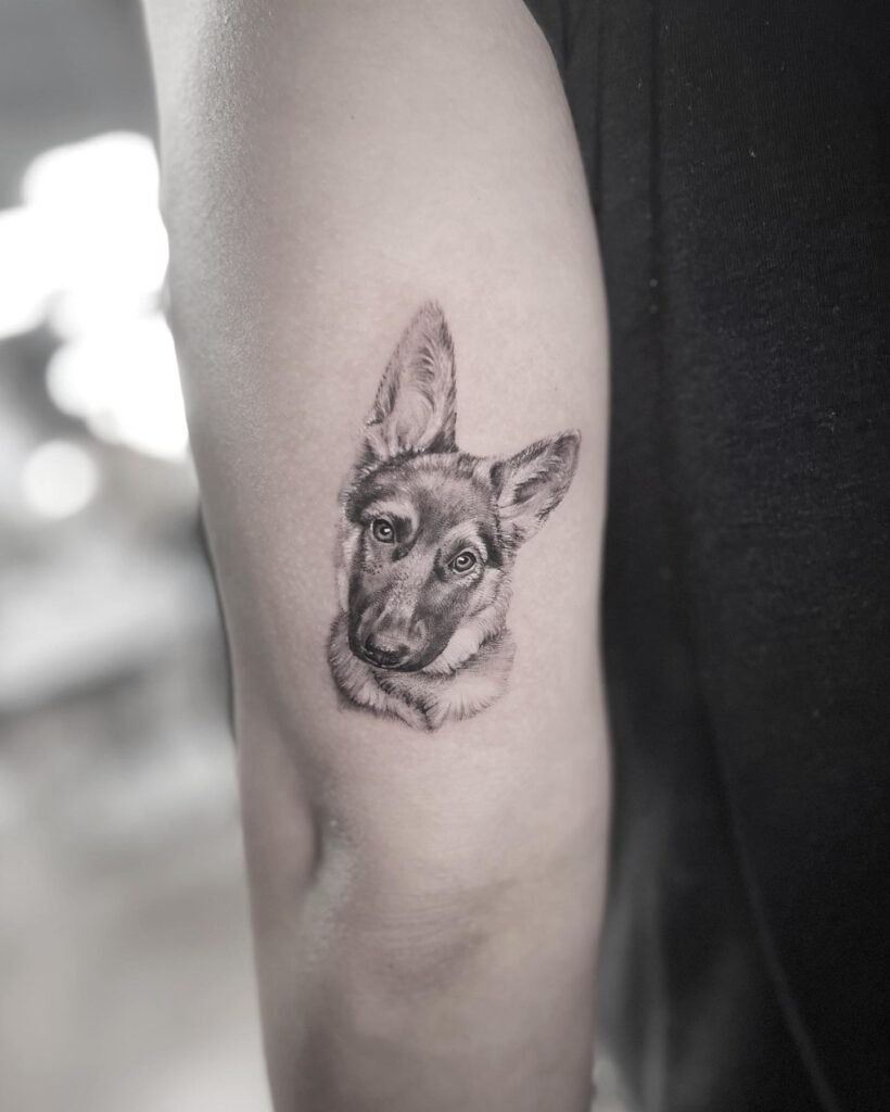 Cute Baby German Shepherd Tattoo on Outer Elbow for Women Endearing Canine Artwork