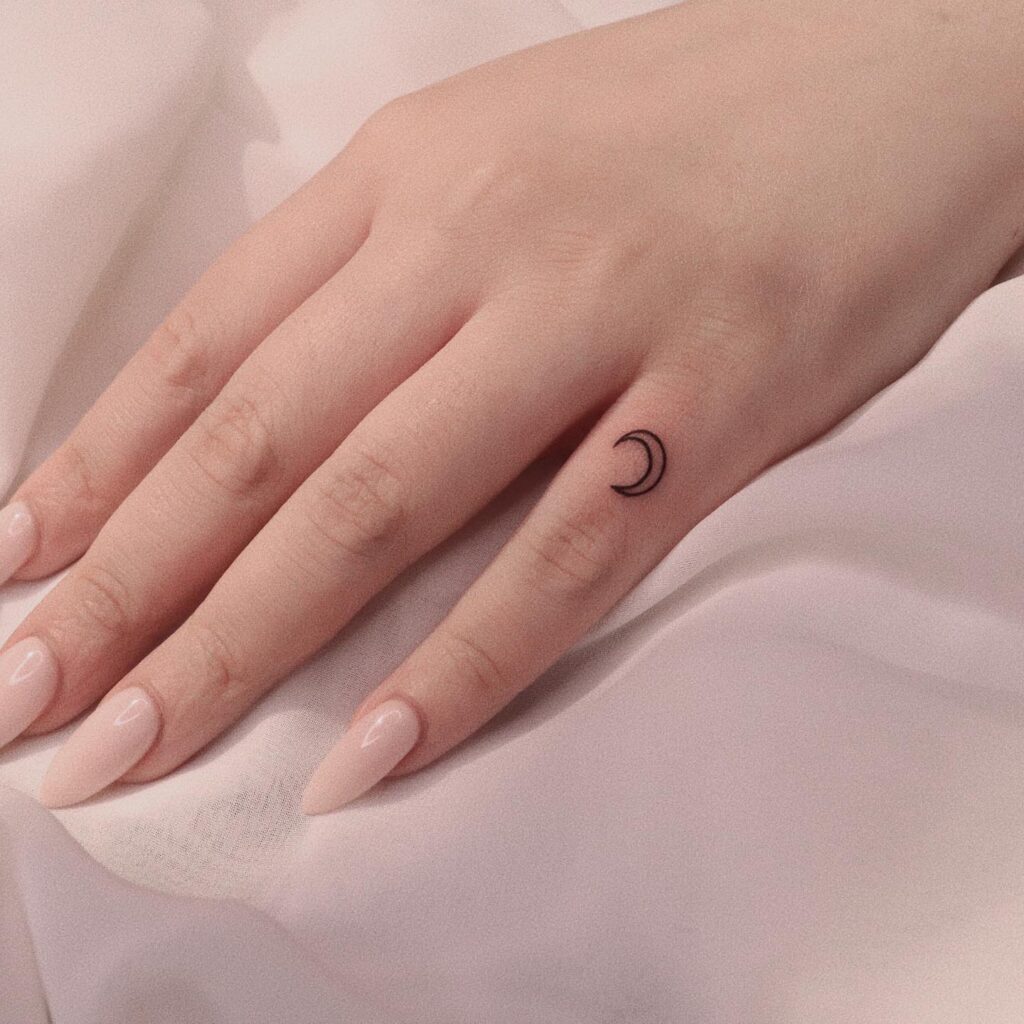 Cute Tiny Minimalist Crescent Moon Tattoo on the Little Finger Bringing Subtle Lunar Magic: Celestial Whispers