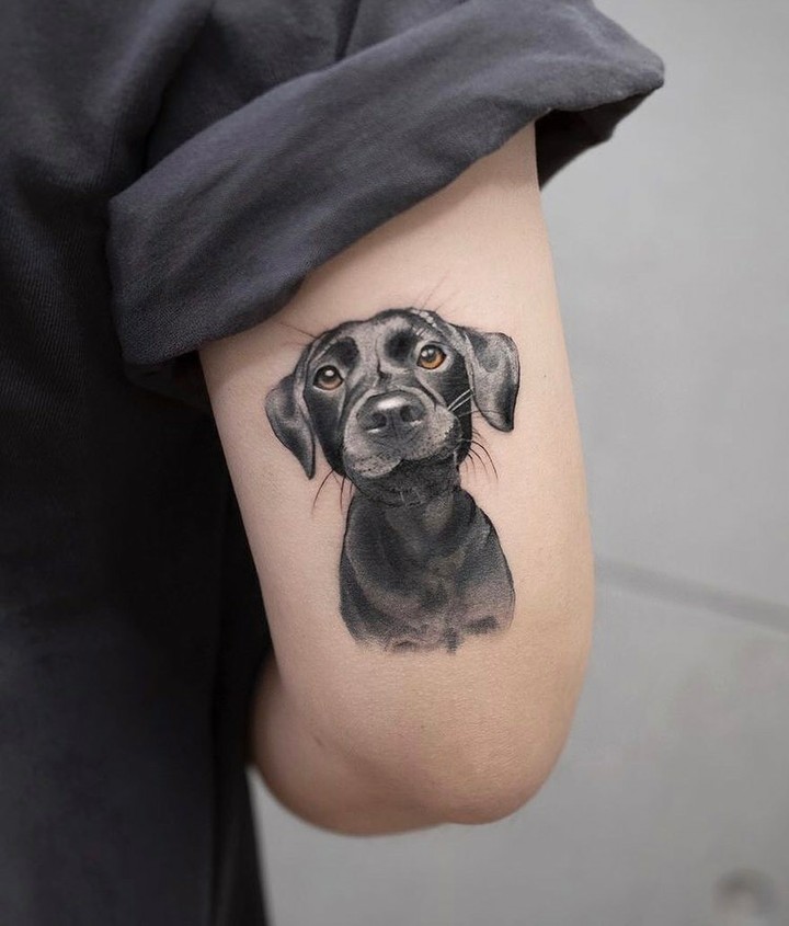 Cute Black Labrador Face Tattoo Above the Elbow for Dog Enthusiasts: Labrador Love