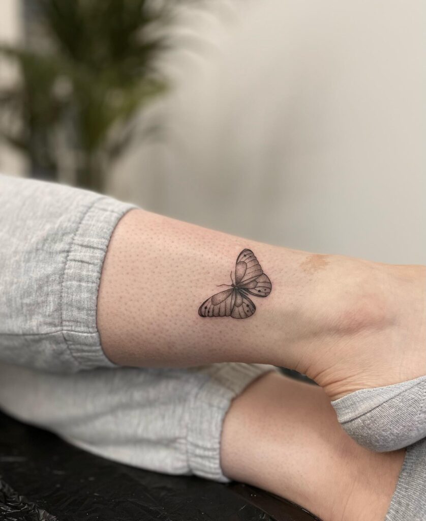 Cute Detailed Butterfly Tattoo on the Leg, a Graceful Flutter: Delicate Wings