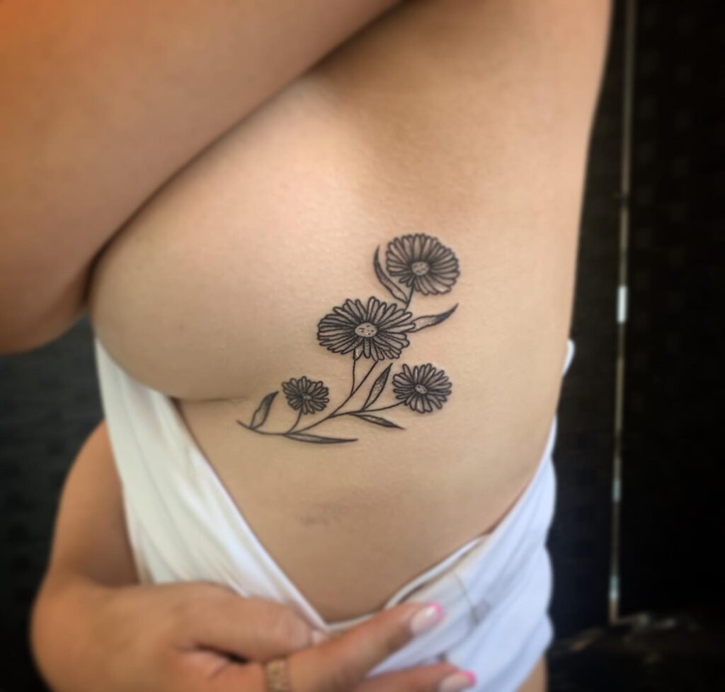 Cute flowers rib tattoos for women black ink floral elegance on the rib