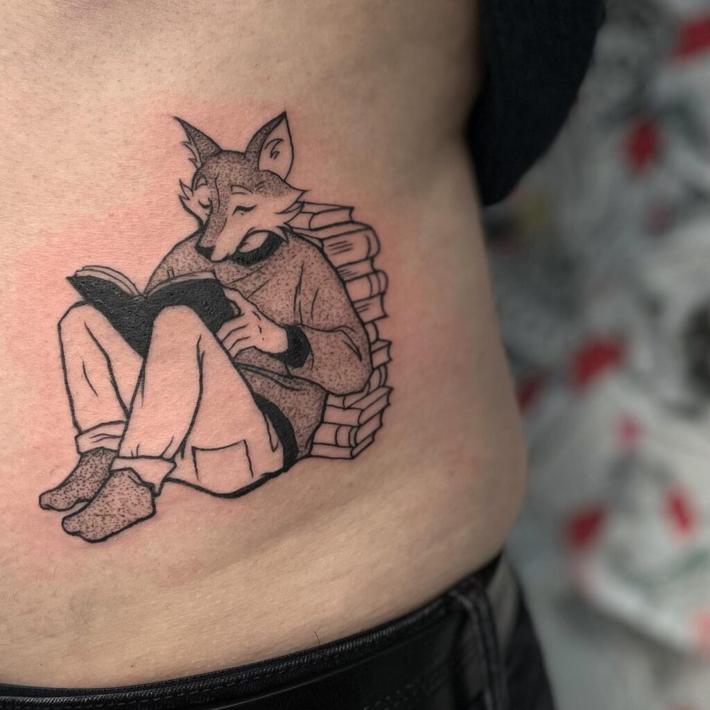Cute Fox Reading a Book Tattoo on the Side of the Stomach: Bookish Charm