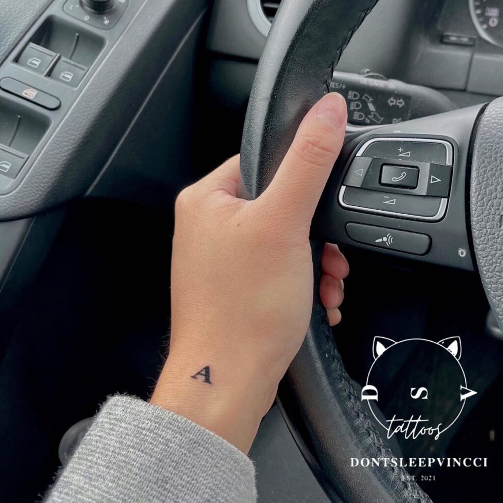Cute Letter Tattoo on the Side of the Wrist: Whimsical 'A'