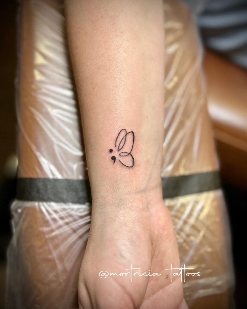 Cute Linework Semicolon Butterfly Tattoo on the Inner Wrist: Whimsical Flutter